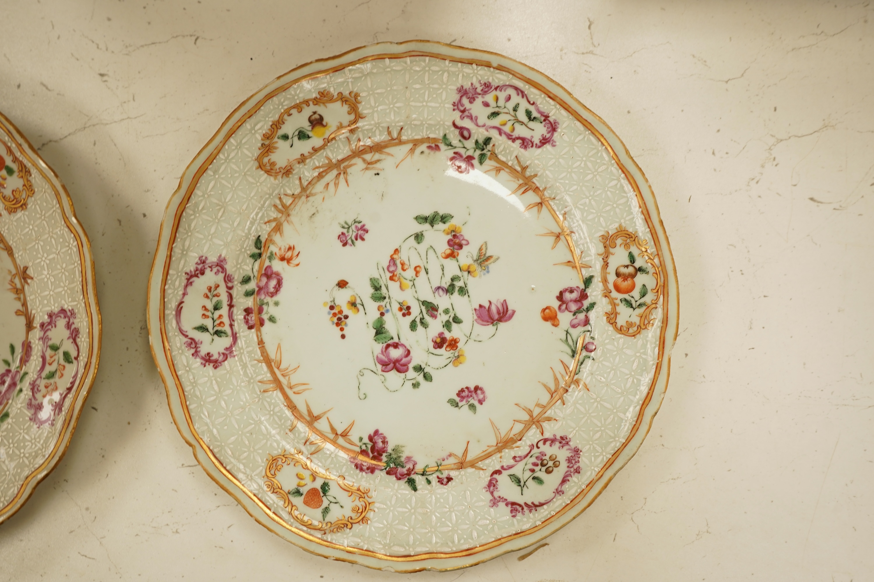 A pair of 18th century Chinese famille rose and bianco-sopra-bianco plates, 24cm